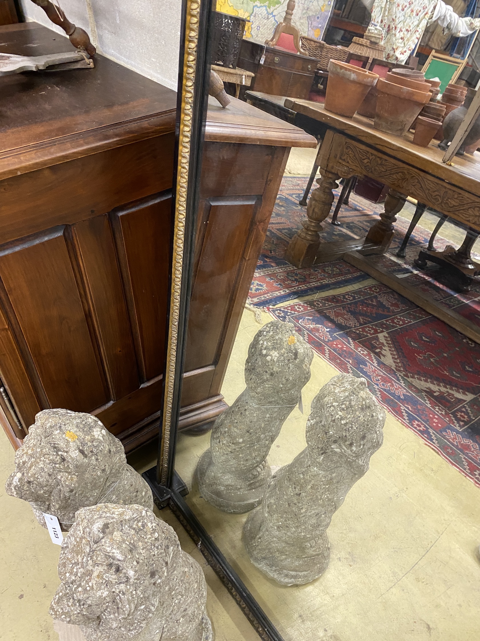 A late Victorian ebonised parcel gilt overmantel mirror, width 151cm, height 154cm